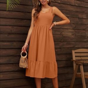 Ruffle hem tie back dress